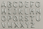 Silver helium balloons in the shape of letters A through Z