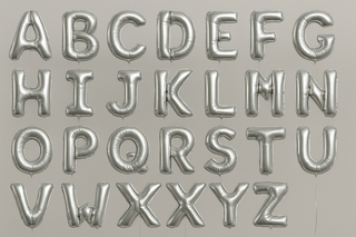 Silver helium balloons in the shape of letters A through Z