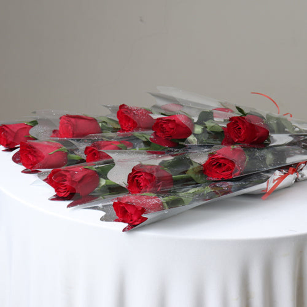 Bouquet of Single Red Rose Stems Wrapped Elegantly for Romantic Occasions