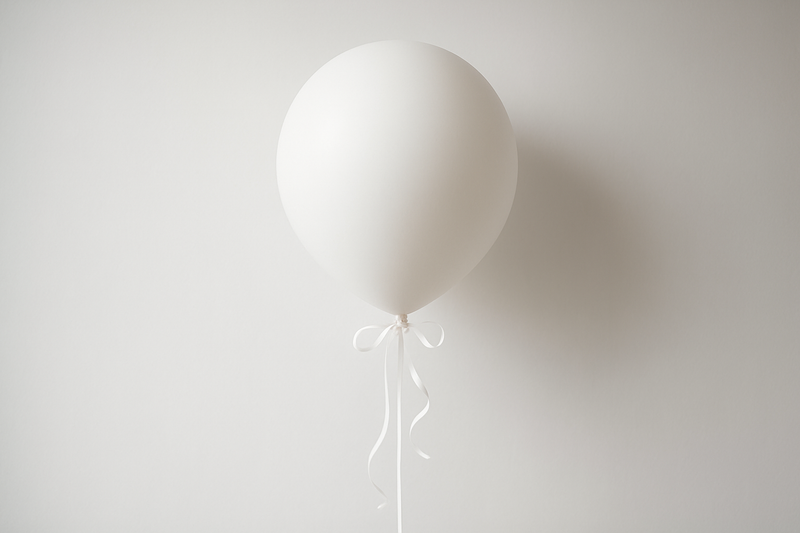 Single white helium balloon