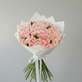 Valentine pink roses bouquet premium fresh roses in white luxury wrapping - same day delivery Kuwait